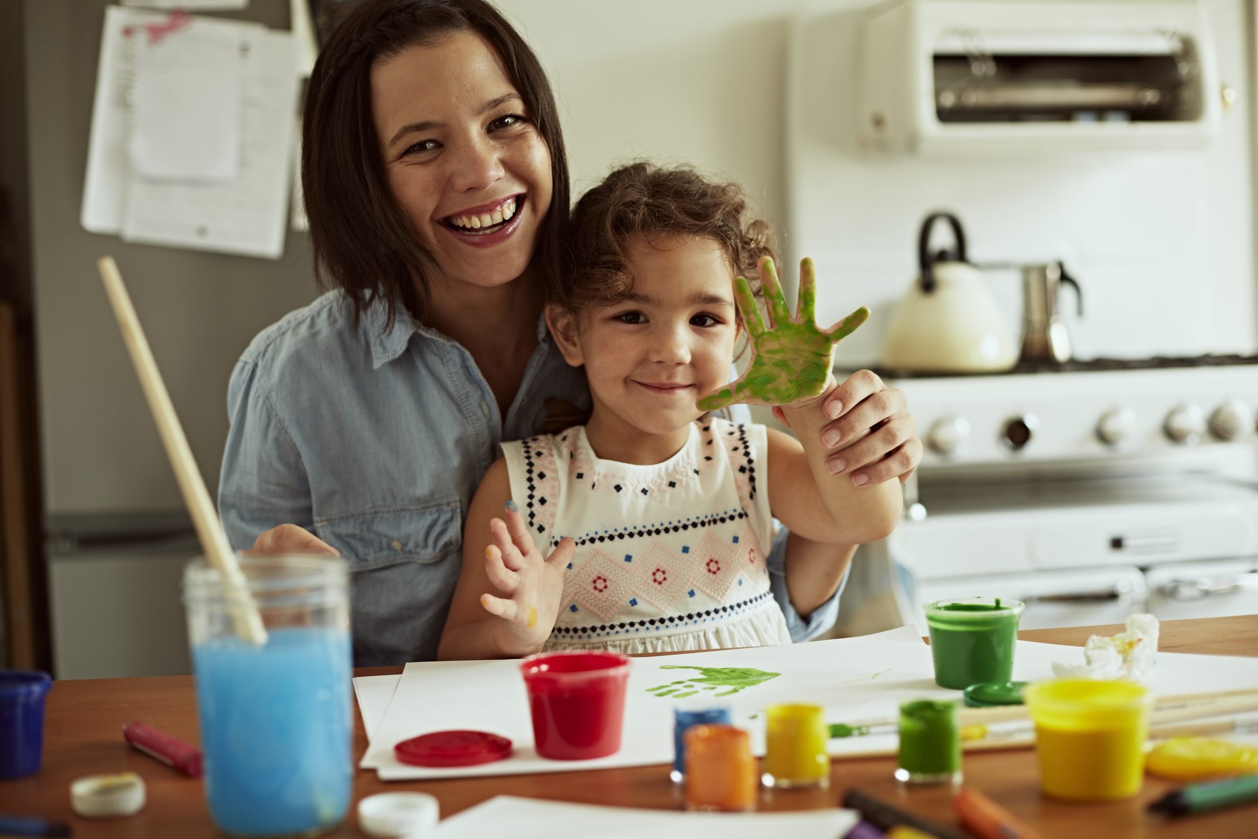Portrait of mother and daughter painting