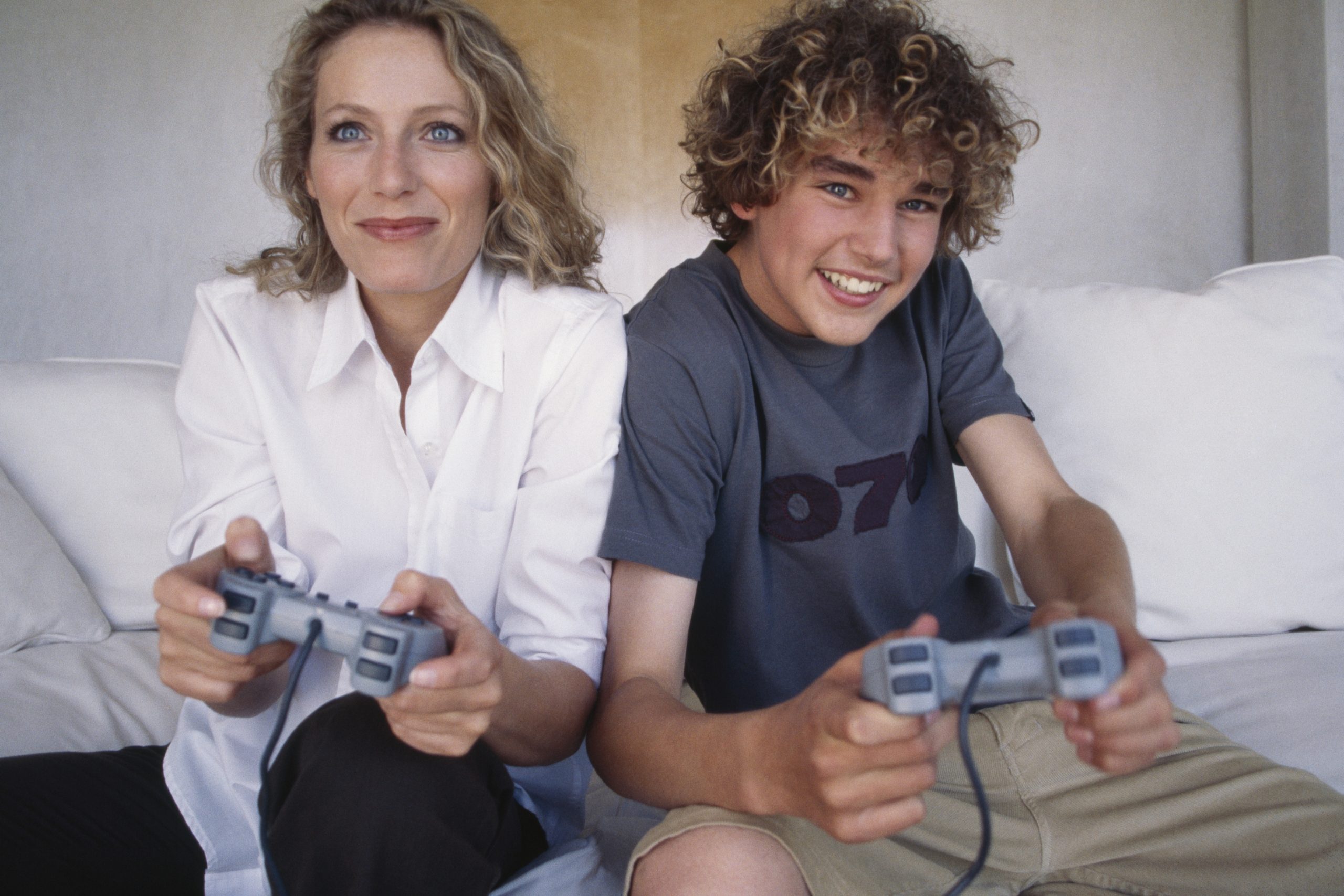 Mother and son playing video games