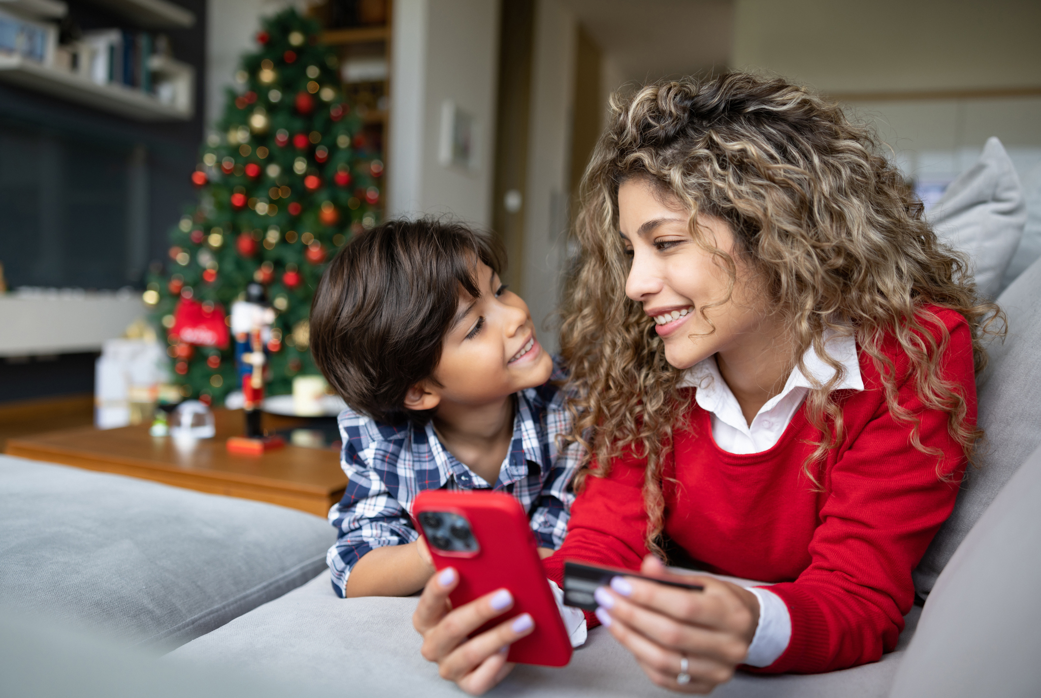 Mother buying a Christmas gift online for her son